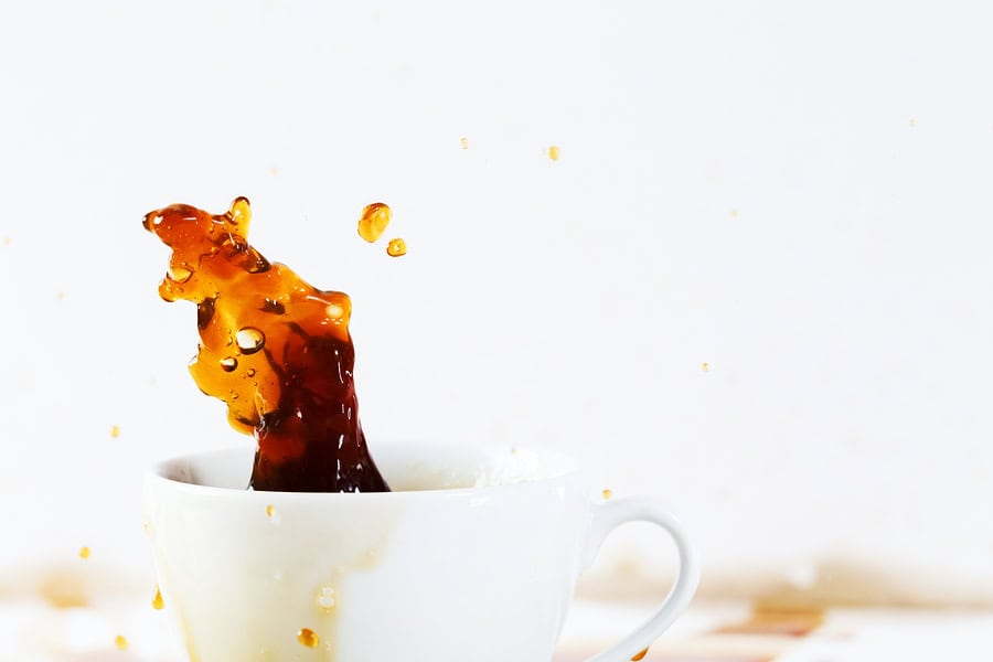 image of coffee spilling out of a cup