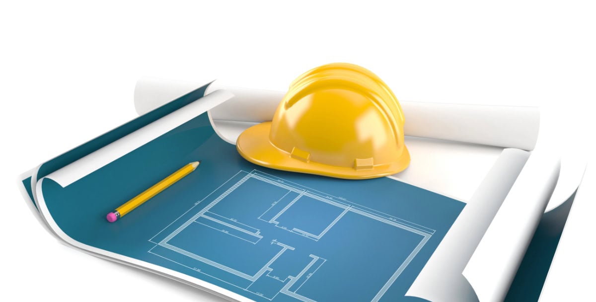 Construction blueprint with yellow safety helmet and pencil on white background.