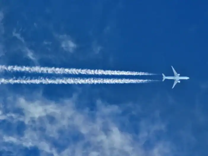 Technical Account Manager aerospace - image of plane flying in blue sky
